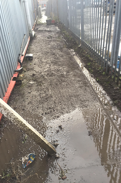 Before photo of pathway covered in wet dirt and mud